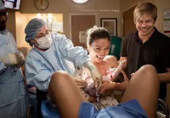 Intended mother catches her baby born via surrogacy.